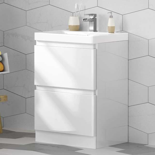 Floor-standing bathroom vanity in dark wood grain with a white ceramic top and mirror cabinet, view 2