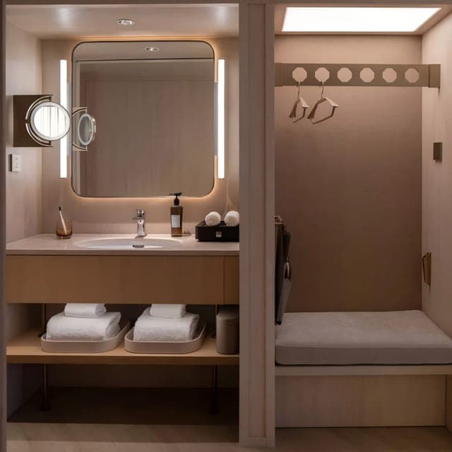 Guest room bathroom vanity and shower area