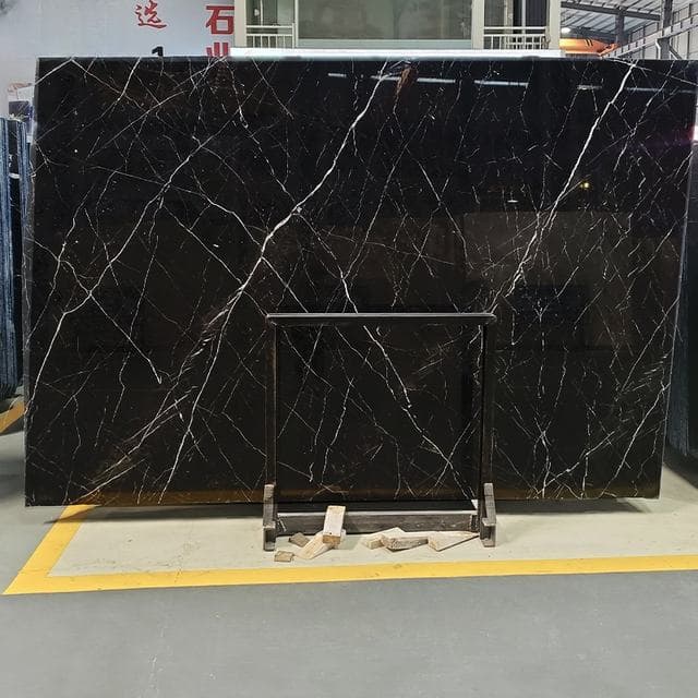 Black marble slab with pale veining