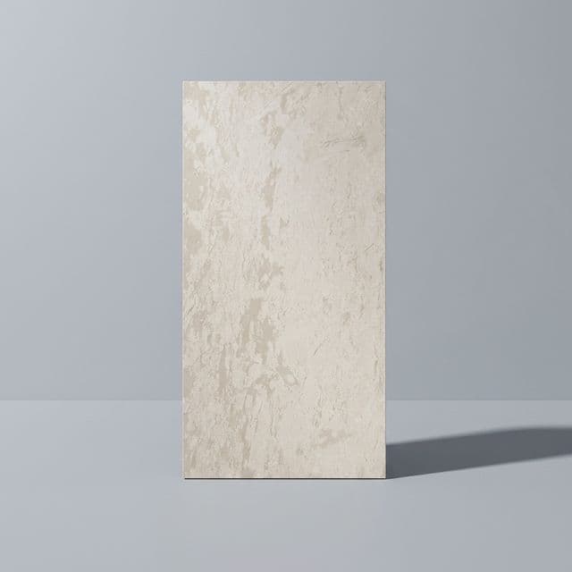 Sintered stone panel standing against a grey wall