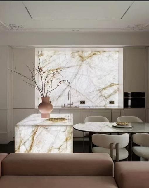 Sintered stone island with matching veined wall panel behind