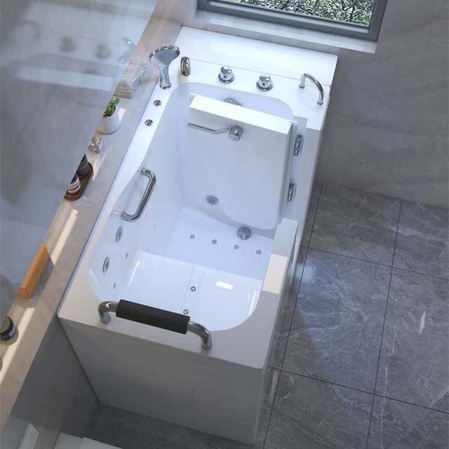 Walk-in bathtub with a side watertight door, a built-in seat and grab rails