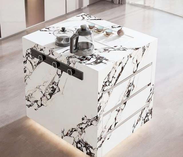 Waterfall island with continuous marble veining running down both ends