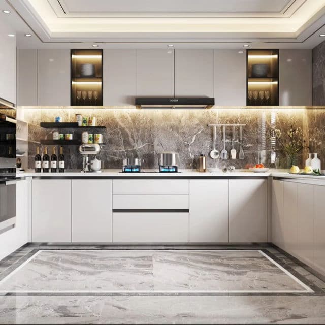 U-shaped kitchen with grey and white cabinets and integrated lighting