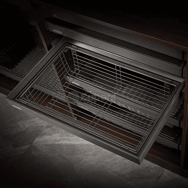 Dark wire basket organiser sliding out of a cabinet